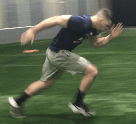 Athlete sprinting on turf